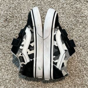 Toddler old school Vans with black, white and gray camo print.